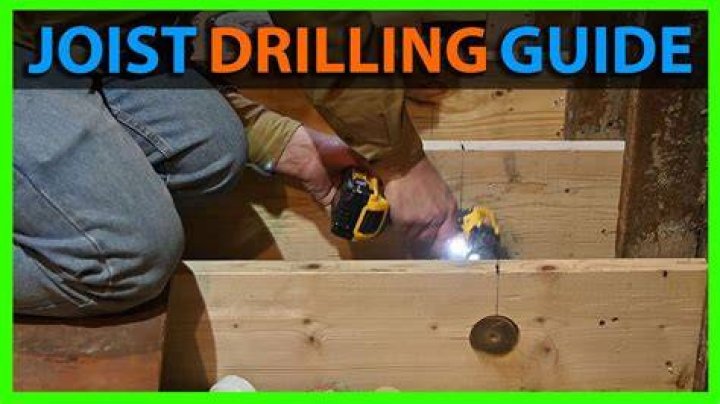 Can I drill a 2 hole in a 2×8 floor joist