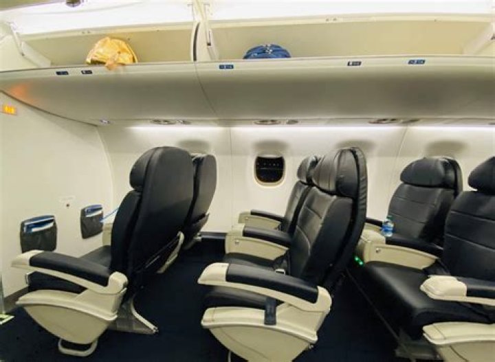 How do first class upgrades work on Alaska