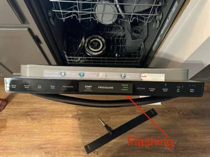 How do I fix the flashing light on my Whirlpool dishwasher