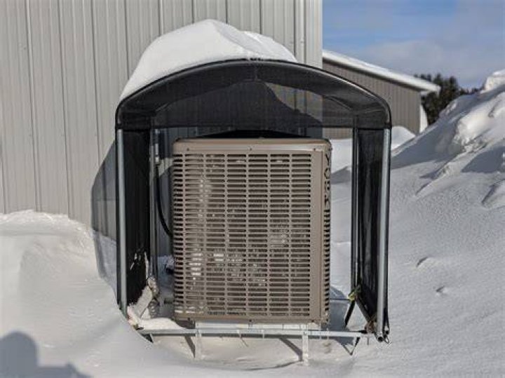 How do I keep snow off my heat pump