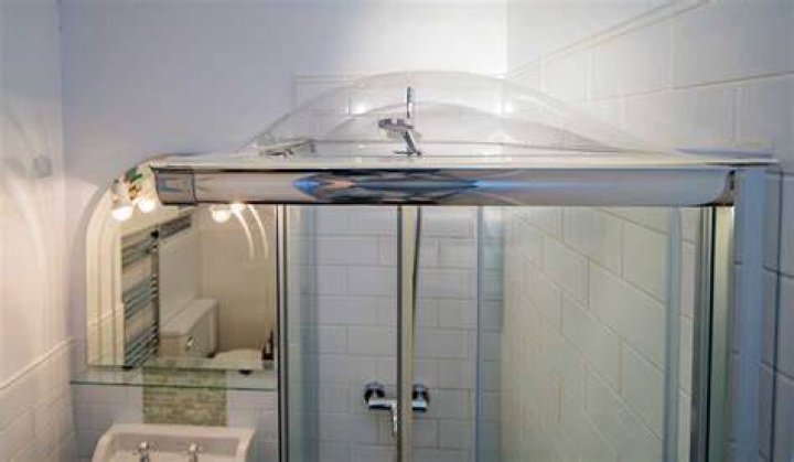 How do you clean a shower Dome