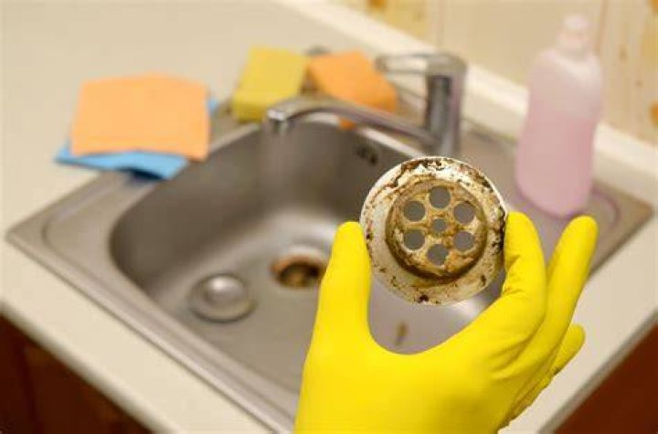 How do you clean household drains