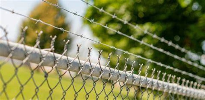How do you jump a fence with barbed wire